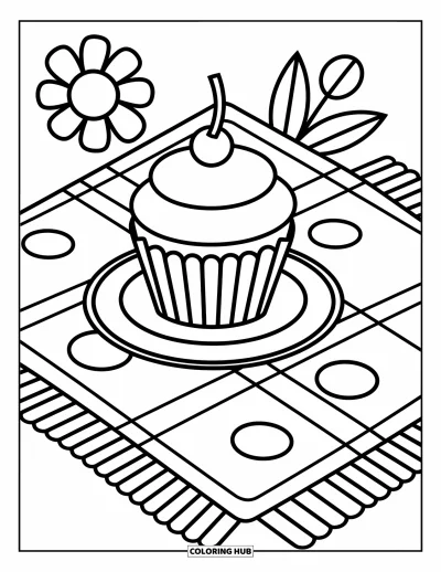 Coloriage de cupcakes pour enfants : Un cupcake sur une assiette près d’une couverture de pique-nique avec une fleur à côté