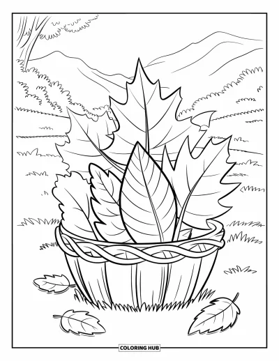 Coloriage de feuilles d'automne pour enfants : Des feuilles en vrille remplissent un panier tressé posé dans une prairie herbeuse au pied des montagnes